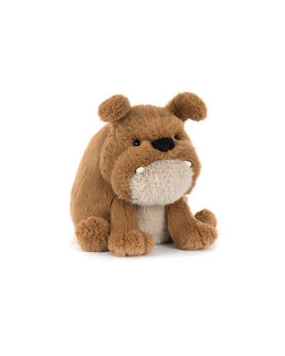 Jellycat Derreck Dog is a plush bulldog with soft brown fur, a beige belly, floppy ears, and two white fabric teeth, shown sitting upright on a white background.