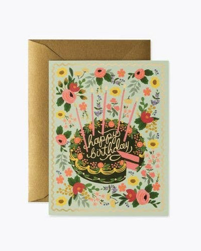 The Floral Cake Birthday - Card showcases vibrant flowers and a cake with candles, with "Happy birthday" in cursive on the cake. It comes with a metallic gold foil envelope, making it ideal for your personalized birthday wishes.