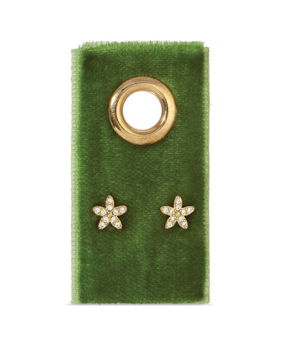The Pave Flower Studs on Velvet Gift Tag - Gold feature star-shaped earrings adorned with sparkling cubic zirconia, elegantly displayed on a green velvet card with an 18K gold grommet.