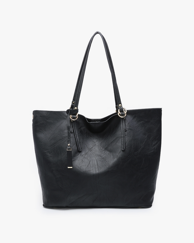 The Iris Monogrammable 2-in-1 Tote Bag in black vegan leather features two shoulder straps, gold-tone hardware, and a minimalist design, shown against a plain white background.
