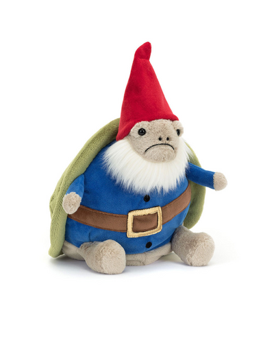 A plush Jellycat Gnome Timmy Turtle with a soft, round beige body dressed as a gnome. The plush features a fluffy white beard, a blue coat with a brown belt, and a classic red gnome hat. The turtle shell on its back is green with stitched detailing, and its small limbs are light beige.