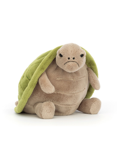 A large plush turtle with a soft beige body and a green shell draped over its back. Timmy Turtle has a slightly grumpy yet endearing expression, complete with small black eyes and a downturned mouth. His plush limbs rest on the ground, showcasing a cuddly and huggable shape.