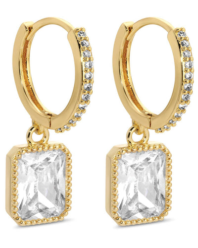 Gold-plated earrings named "Pave Huggies with a Rectangle Drop - Clear" feature hoops with embedded clear gemstones and hanging rectangular crystals in textured gold frames.