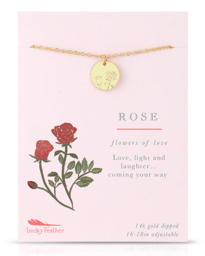 An elegant gold-dipped necklace with a circular pendant etched with a rose design, symbolizing love. Presented on a card adorned with rose illustrations and the phrase "Flowers of Love."