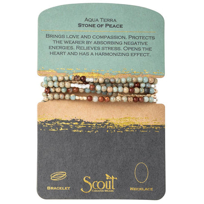 The Stone Wrap - Aqua Terra/Gold/Silver - Stone of Peace by Scout is a convertible wrap with multicolored bead bracelets on a card, embodying love, compassion, and stress relief.